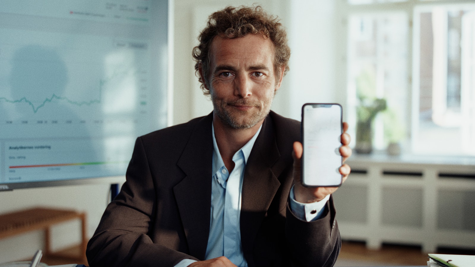 Investeringsapp vist på smartphone.